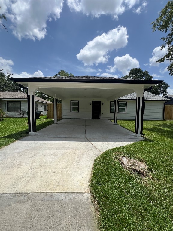 7613 Lady Street Houston, TX 77021 - Photo 2 of 18 a view of a house with a yard and a garage