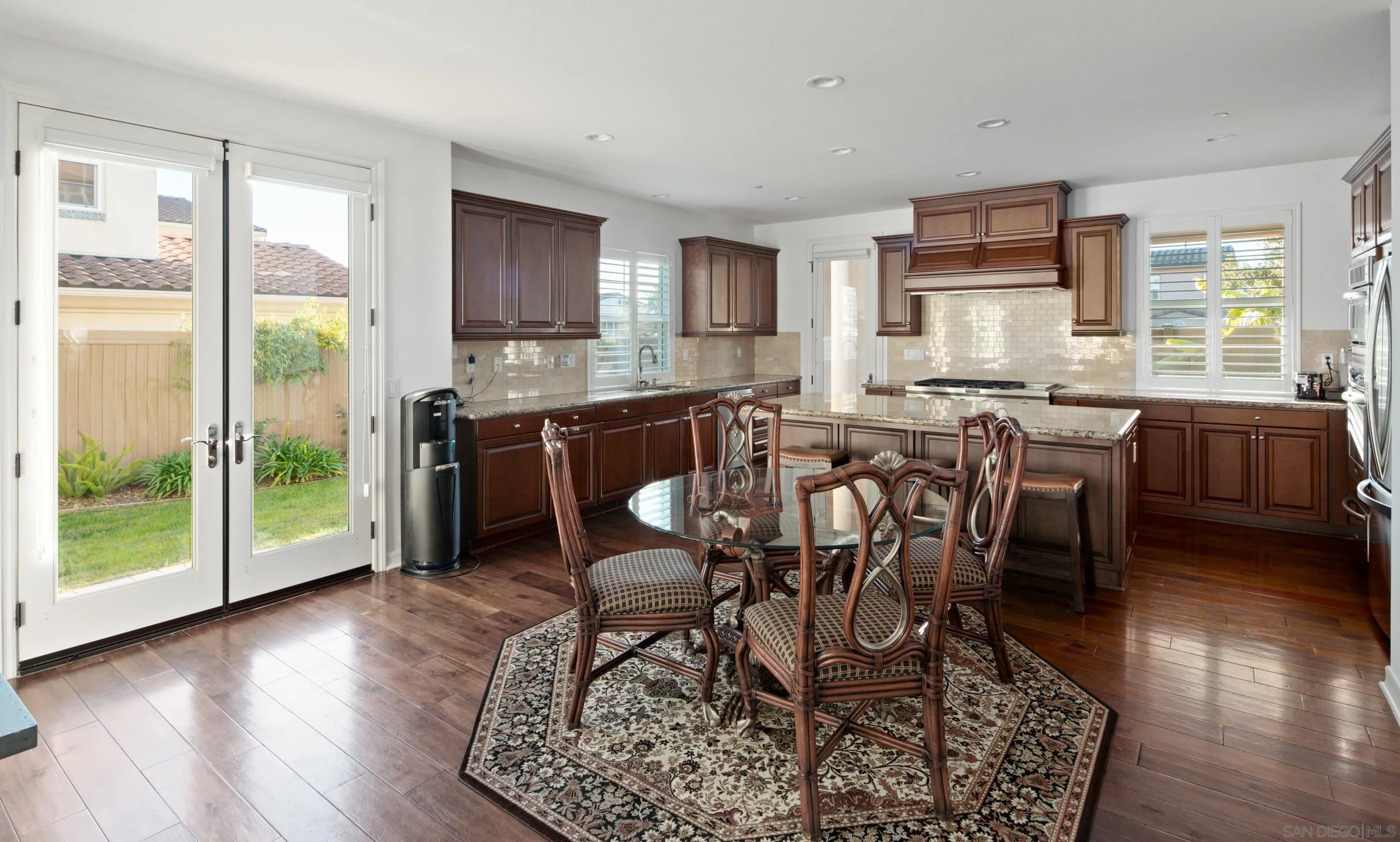 931 Bluejack Road Encinitas, CA 92024 - Photo 13 of 37 a view of a dining room with furniture window and wooden floor