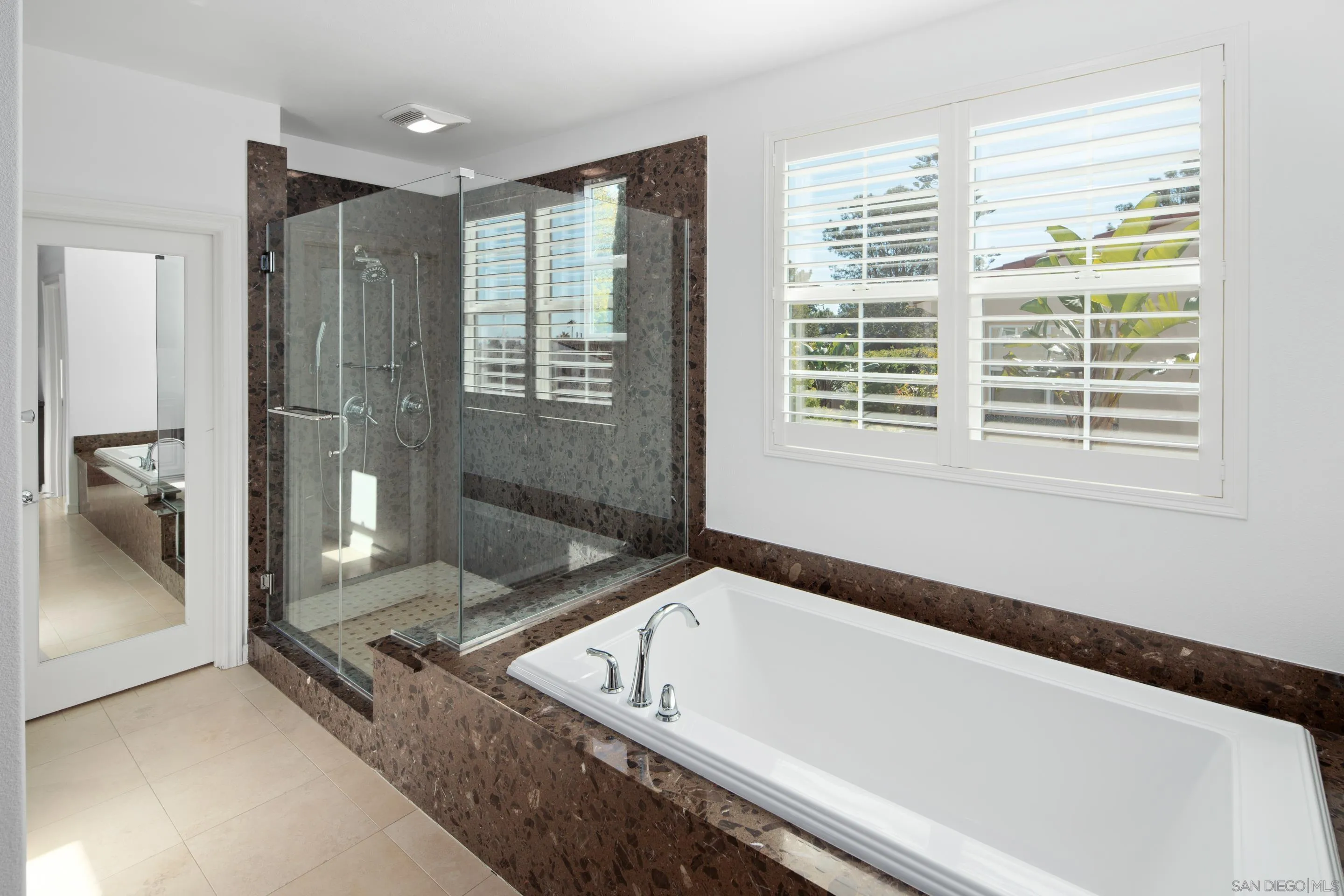 931 Bluejack Road Encinitas, CA 92024 - Photo 22 of 37 a bathroom with a bathtub and a shower