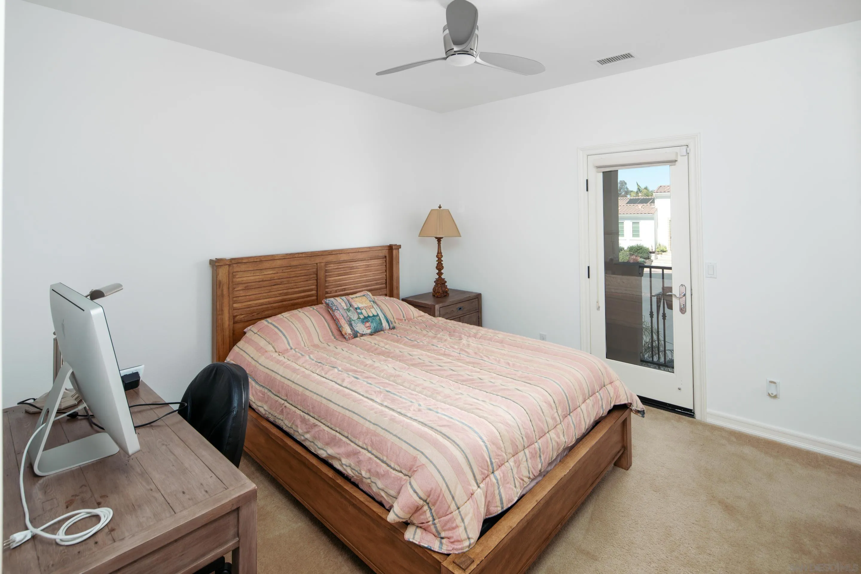 931 Bluejack Road Encinitas, CA 92024 - Photo 24 of 37 a bedroom with a bed and cabinets