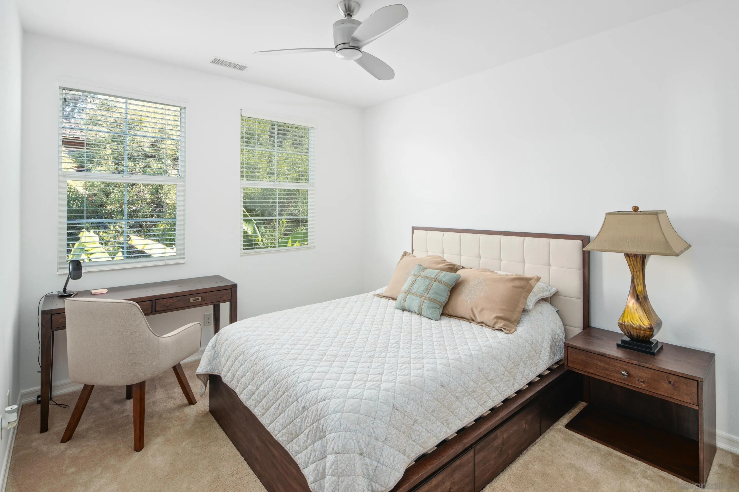 931 Bluejack Road Encinitas, CA 92024 - Photo 27 of 37 a bedroom with a bed and a table