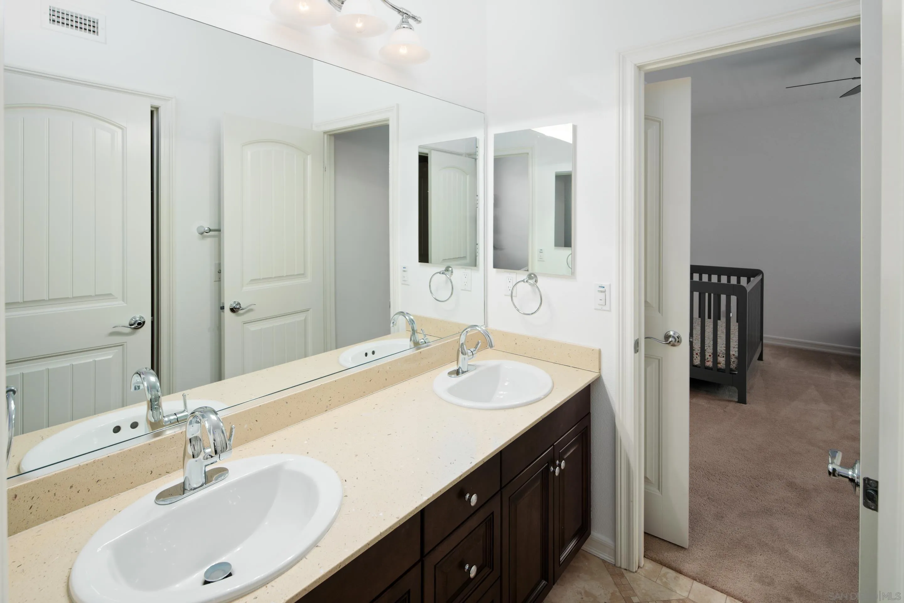 931 Bluejack Road Encinitas, CA 92024 - Photo 28 of 37 a bathroom with a sink and a mirror