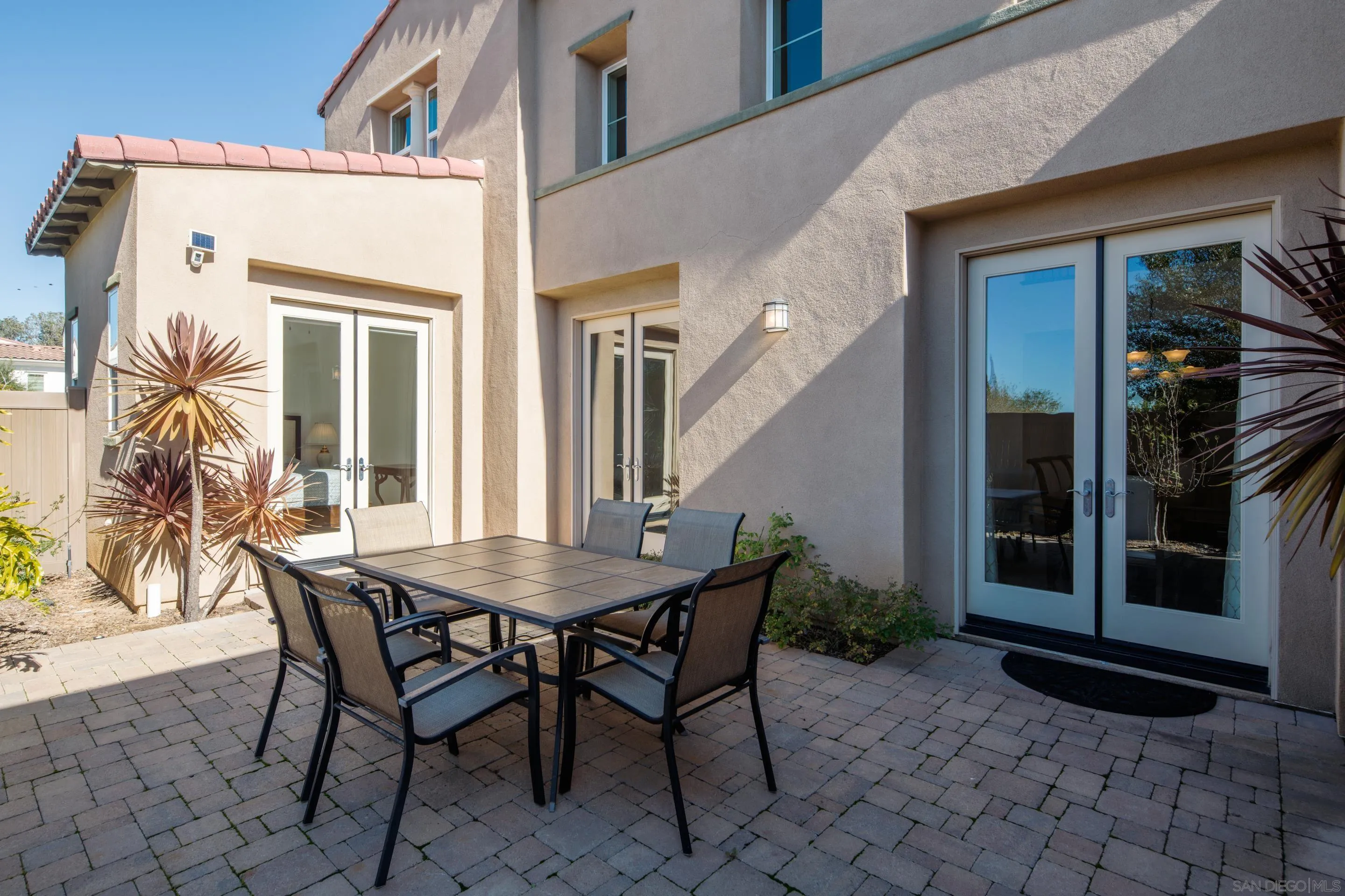 931 Bluejack Road Encinitas, CA 92024 - Photo 30 of 37 a view of a patio with table and chairs and potted plants