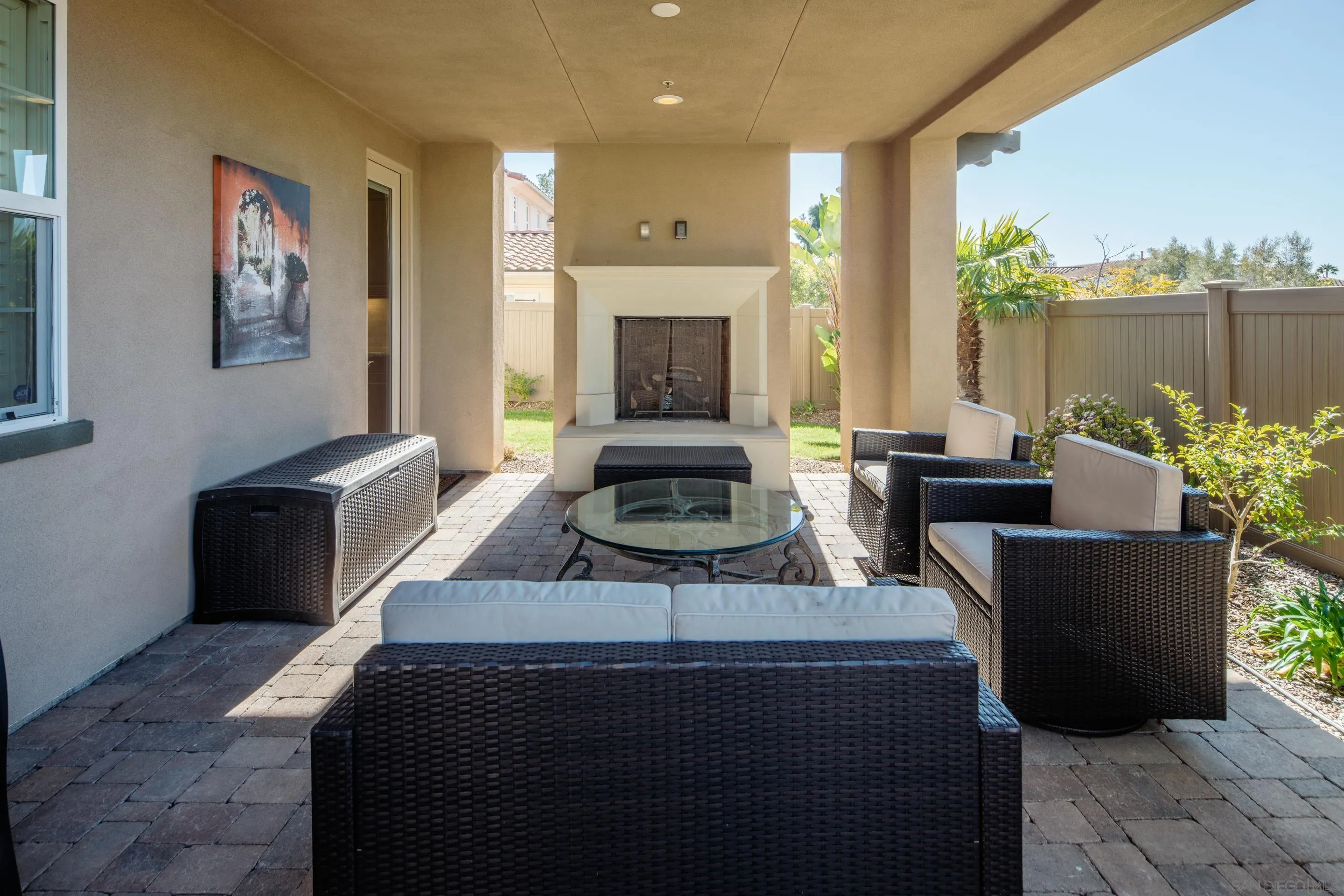 931 Bluejack Road Encinitas, CA 92024 - Photo 32 of 37 a living room with furniture and a fireplace