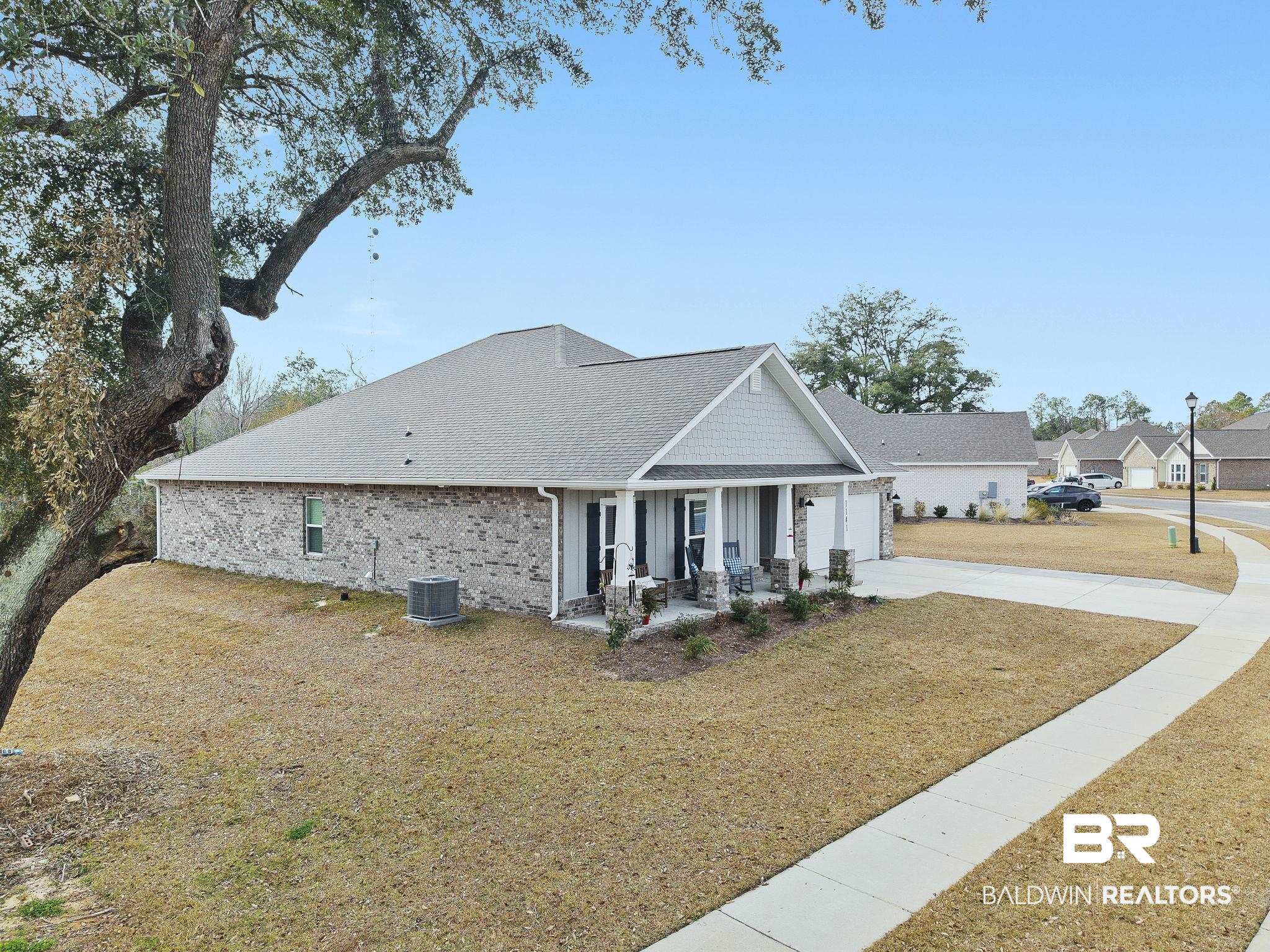 1141 Pencarro Boulevard Foley, AL 36535 - Photo 61 of 70 Craftsman inspired home with a porch, a front yard, and central air condition unit