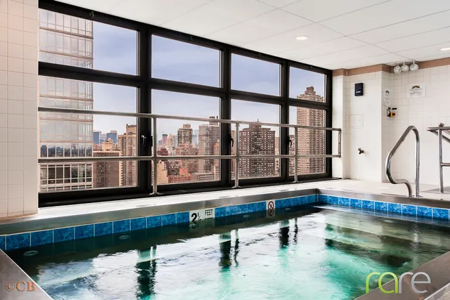 a living room filled with furniture and a window