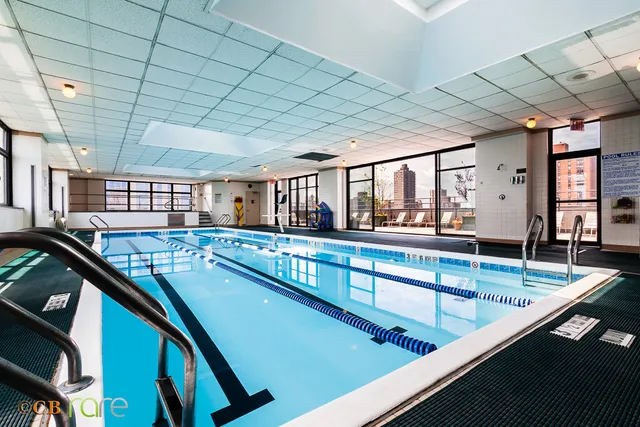 a view of a swimming pool with a balcony