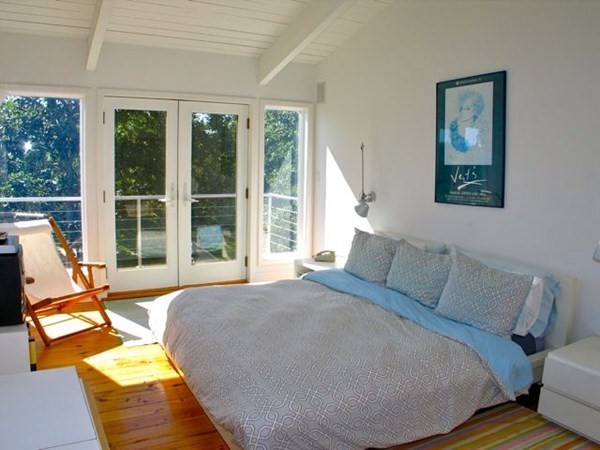 2 Nonamesset Road Edgartown, MA 02539 - Photo 17 of 36 a bed sitting in a bedroom next to a window
