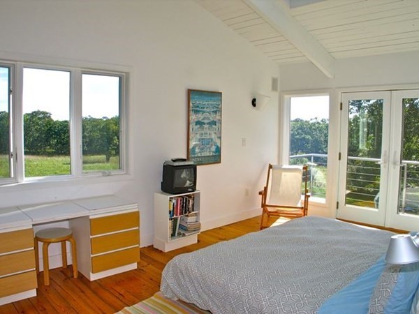 2 Nonamesset Road Edgartown, MA 02539 - Photo 18 of 36 a bedroom with a bed and a large window