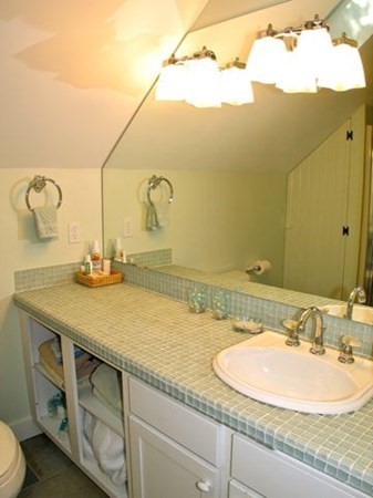 2 Nonamesset Road Edgartown, MA 02539 - Photo 20 of 36 a bathroom with a sink and a mirror