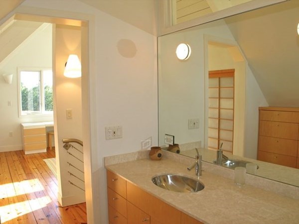 2 Nonamesset Road Edgartown, MA 02539 - Photo 21 of 36 a bathroom with a sink and a mirror