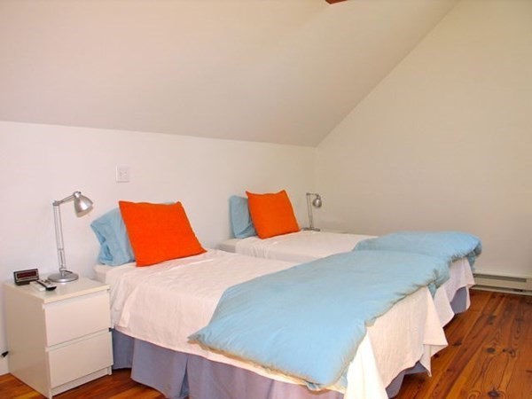 2 Nonamesset Road Edgartown, MA 02539 - Photo 25 of 36 a bedroom with a bed and window