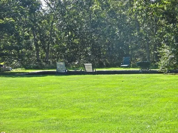 a view of a table and chairs under an umbrella