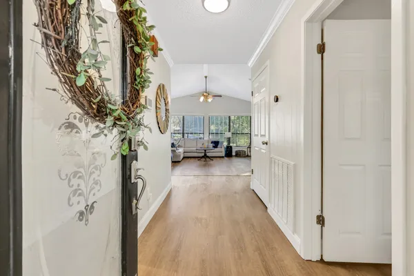 a view of a hallway view with living room