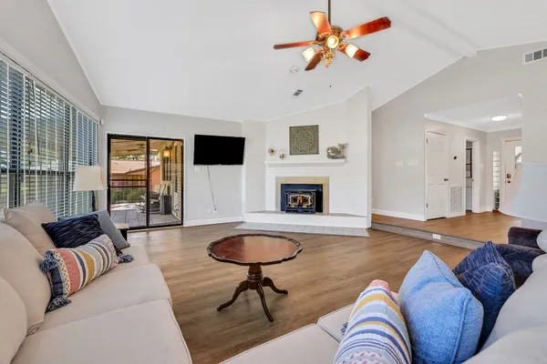 a living room with furniture and a fireplace