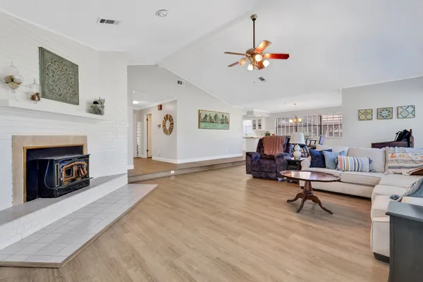 a living room with furniture and a fireplace