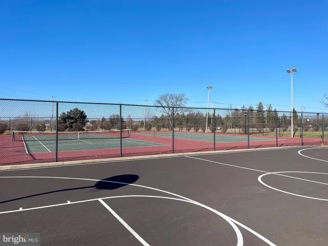 a view of a tennis court with basket ball court