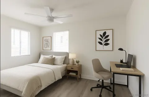 a bedroom with a bed and a desk