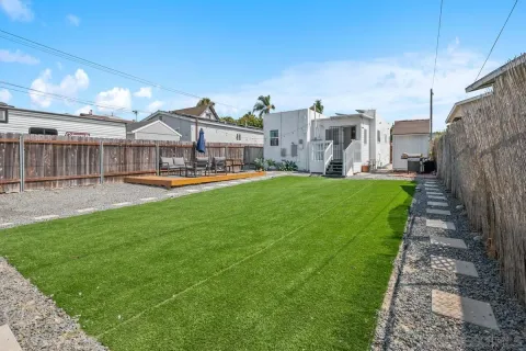 a view of a house with swimming pool in front of it