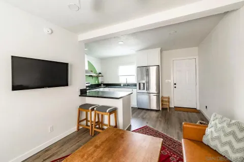 a living room with furniture and a rug