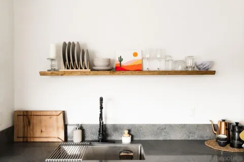 a bathroom with a sink toilet and shower curtain