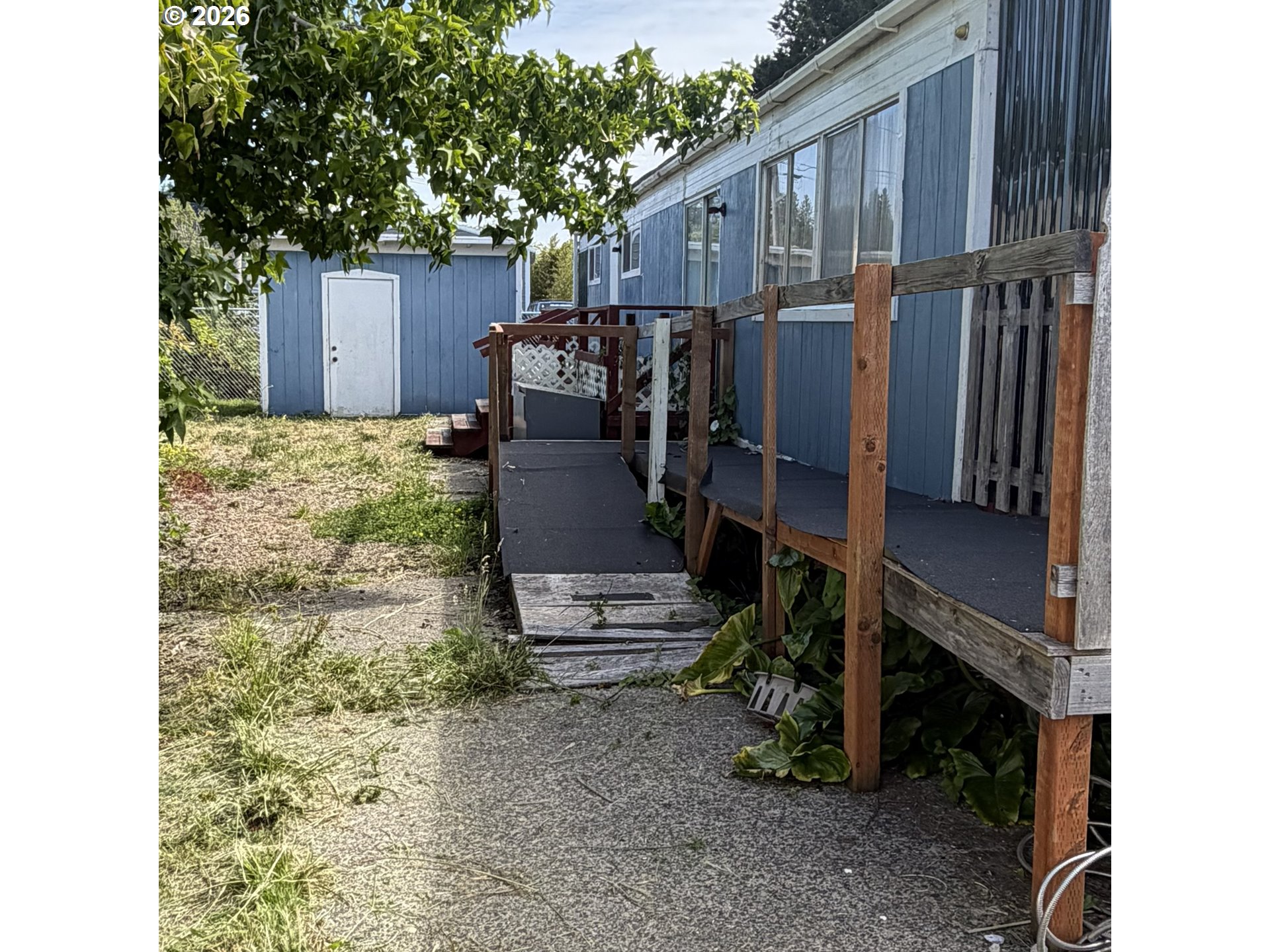 1000 North 8th Street, Unit 54 Reedsport, OR 97467 - Photo 21 of 29 a view of a house with backyard and sitting area
