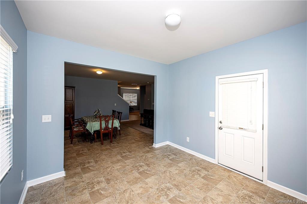 9915 Paper Tree Road Charlotte, NC 28227 - Photo 13 of 35 an empty room with furniture and a window
