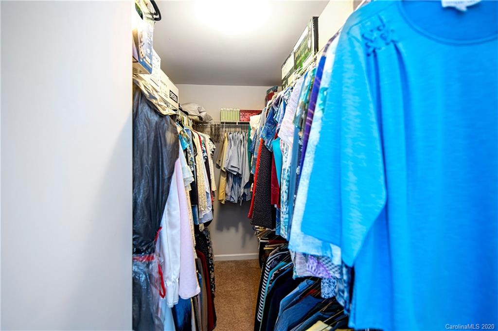 9915 Paper Tree Road Charlotte, NC 28227 - Photo 19 of 35 a view of walk in closet with clothes