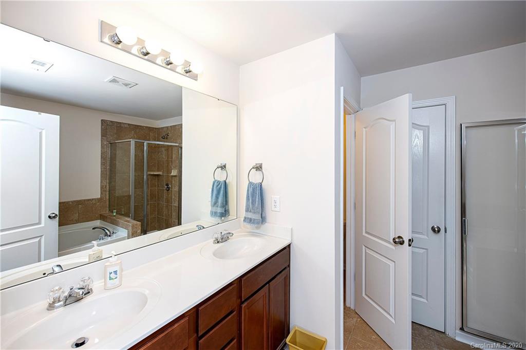 9915 Paper Tree Road Charlotte, NC 28227 - Photo 20 of 35 a bathroom with a double vanity sink mirror and double