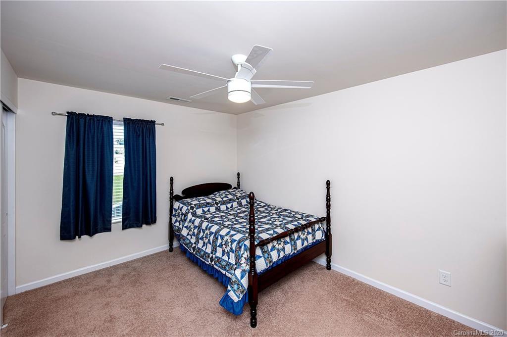 9915 Paper Tree Road Charlotte, NC 28227 - Photo 23 of 35 a room with a bed and window