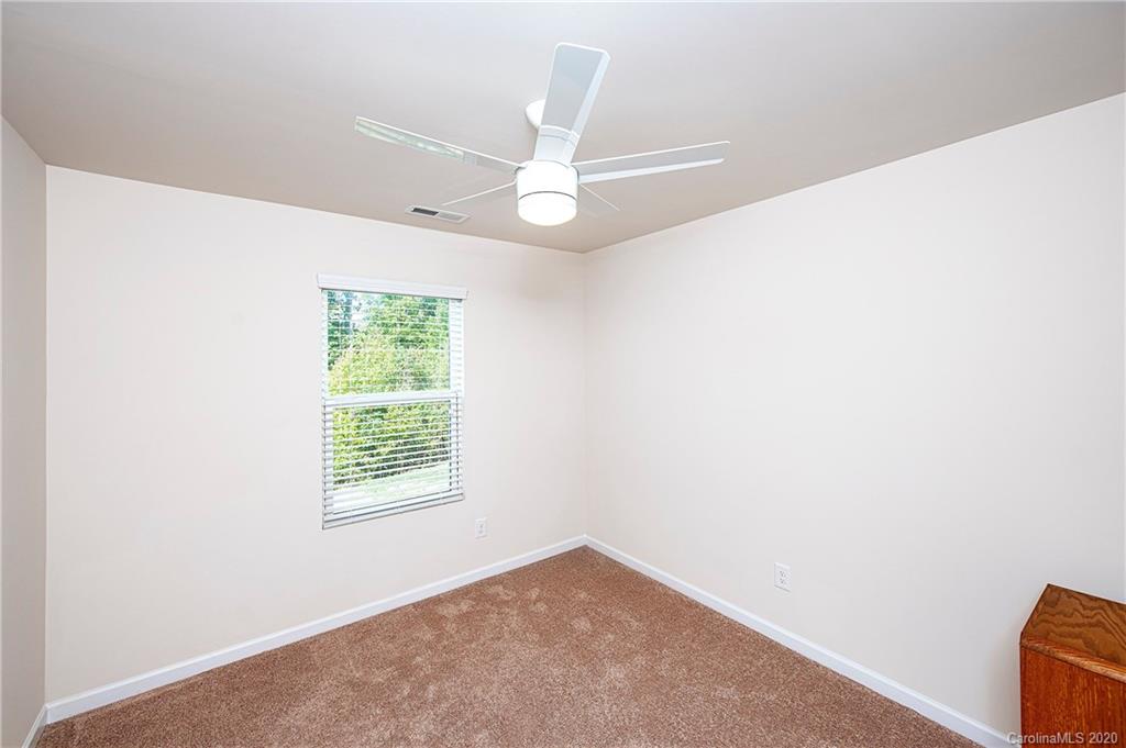 9915 Paper Tree Road Charlotte, NC 28227 - Photo 25 of 35 an empty room with windows and fan