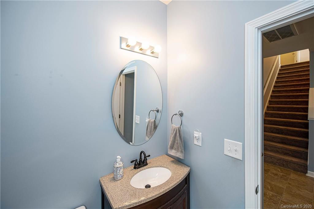 9915 Paper Tree Road Charlotte, NC 28227 - Photo 5 of 35 a bathroom with a sink and a mirror