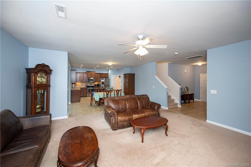 9915 Paper Tree Road Charlotte, NC 28227 - Photo 7 of 35 a living room with furniture and kitchen view