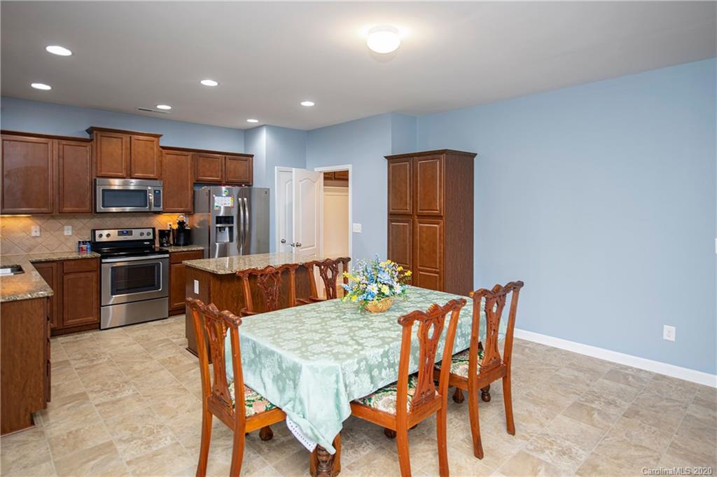 9915 Paper Tree Road Charlotte, NC 28227 - Photo 9 of 35 a view of a dining room with furniture