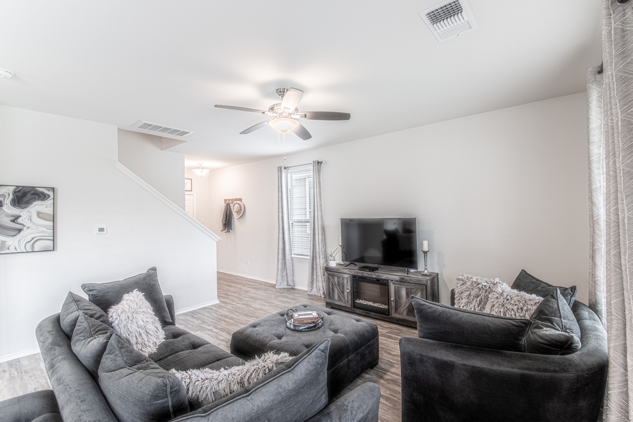 192 Spotted Rail Ridge Leander, TX 78641 - Photo 5 of 34 a living room with furniture and a flat screen tv
