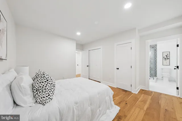 a large white bed in a white room