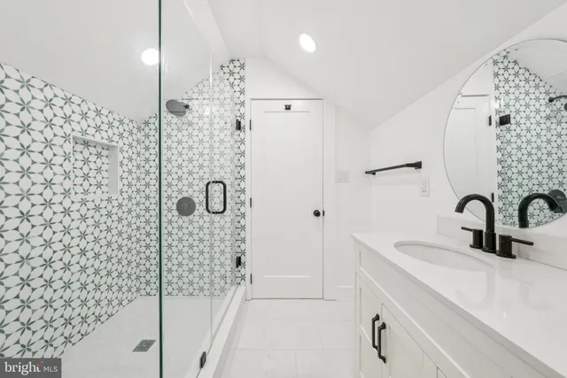 a bathroom with a shower and a sink