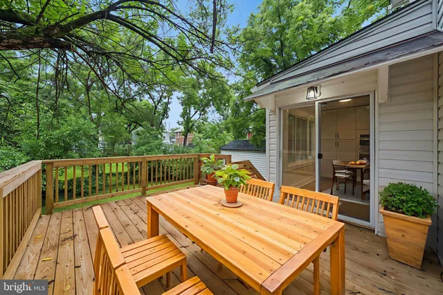 a view of a patio with a table and chairs