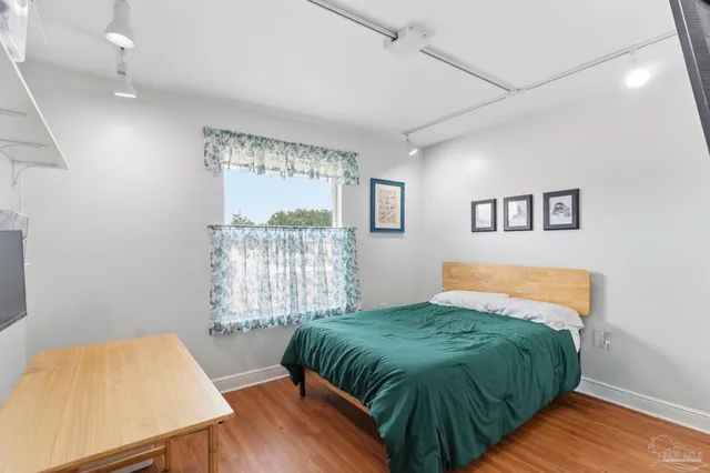 a bedroom with a bed and window