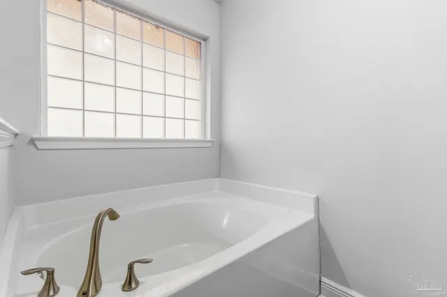 a view of a bathtub in a bathroom