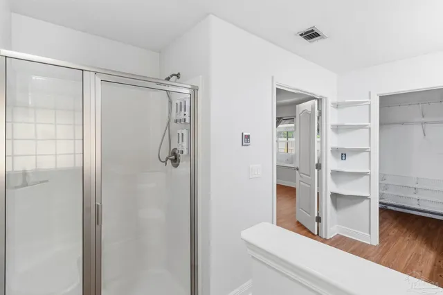 a bathroom with a shower and toilet