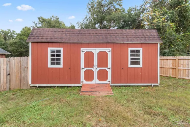 a view of a porch with furniture and front door