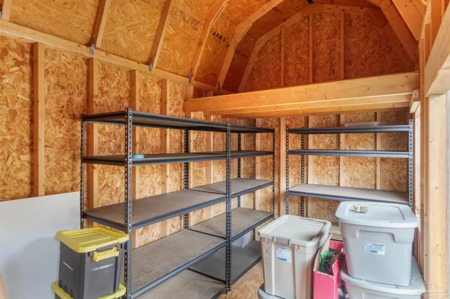 an aerial view of a house with outdoor space
