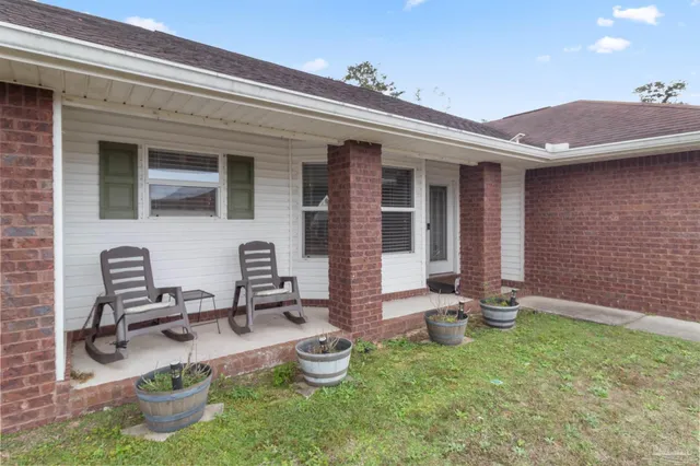 a front view of a house with patio