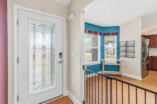 a view of a hallway with windows