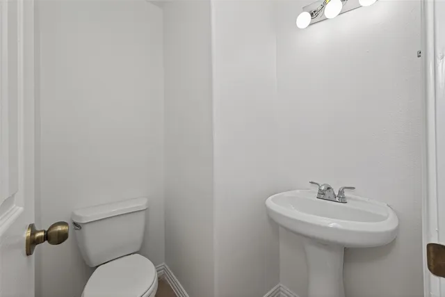 a bathroom with a sink a toilet