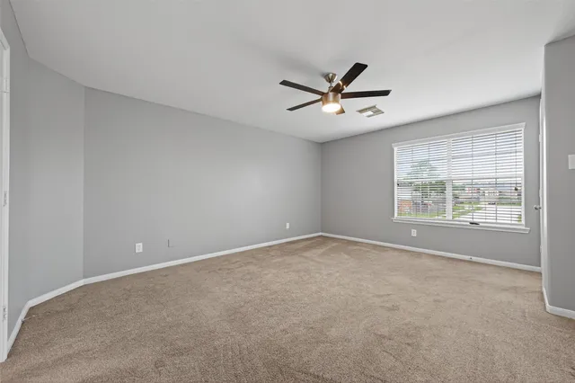 a white bath tub sitting next to a shower