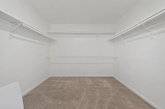 a view of an empty walk in closet
