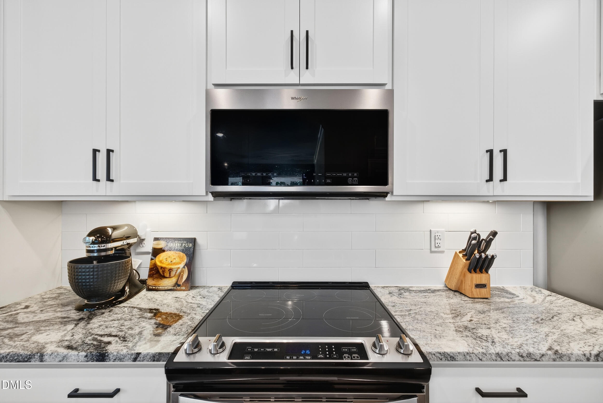 143 Umbrella Way Garner, NC 27529 - Photo 13 of 31 a stove top oven sitting inside of a kitchen