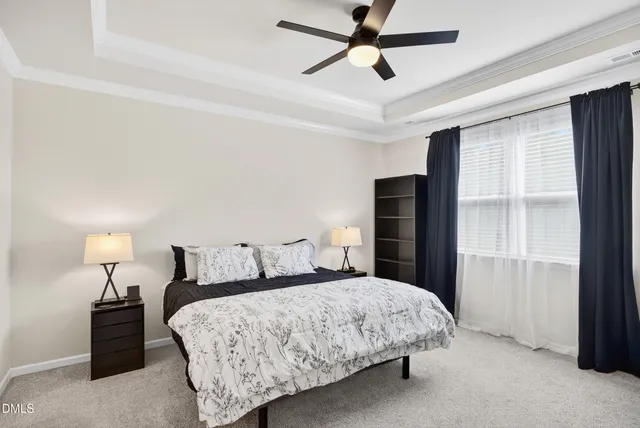 a bedroom with a workspace